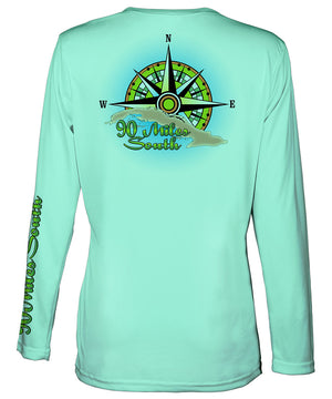 Ladies V-Neck | back view of a sea foam green long sleeve performance v-neck t-shirt depicting a green compass rose artwork and outline of the island of Cuba