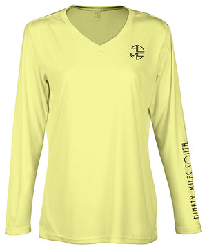 front view of a ladies canary yellow v-neck performance shirt with 90 Miles South Round left chest logo and right sleeve copy saying “90 Miles South”