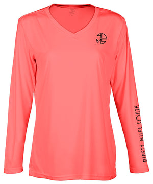 front view of a ladies coral v-neck performance shirt with 90 Miles South Round left chest logo and right sleeve copy saying “90 Miles South”