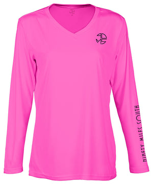 front view of a ladies neon pink v-neck performance shirt with 90 Miles South Round left chest logo and right sleeve copy saying “90 Miles South”