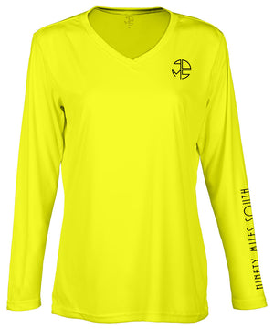 front view of a ladies neon yellow v-neck performance shirt with 90 Miles South Round left chest logo and right sleeve copy saying “90 Miles South”