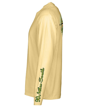 side view of a light yellow long sleeve performance t-shirt featuring 90 miles south sleeve logo