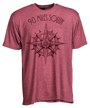 Front view of short sleeve heather burgundy tee shirt with dark burgundy artwork of 90 Miles South compass