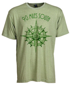 Front view of short sleeve heather green tee shirt with dark green artwork of 90 Miles South compass