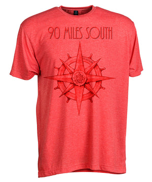 Front view of short sleeve heather red tee shirt with dark red artwork of 90 Miles South compass