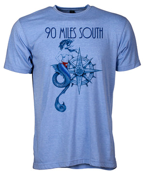 Front view of short sleeve heather blue tee shirt with dark blue artwork of 90 Miles South Mermaid